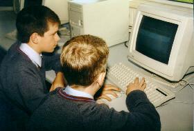 two students working at computer